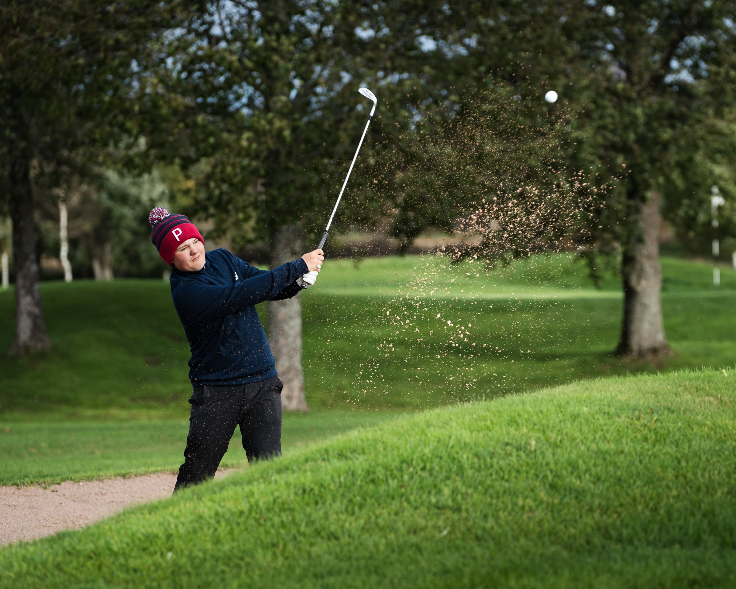 Golfer doing a bunker shot at St. Laurence Golf